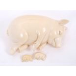 Antique carved ivory model of a sleeping pig, 13.