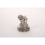 Late 19th century Chinese silver pepperette in the form of a temple lion, on stepped hexagonal base,