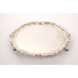 George II silver salver of circular form, with piecrust border and shell and scroll edge,