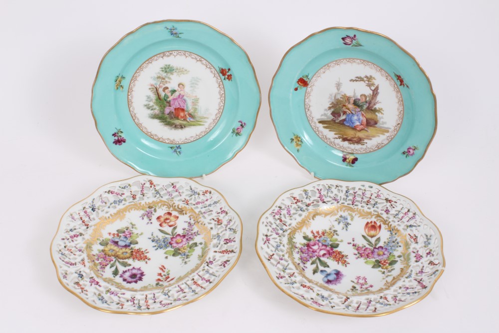 Two 19th century Meissen outside decorated plates painted with romantic figures and floral sprigs,