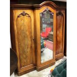 Good Victorian mahogany triple breakfront wardrobe with pierced arched crested cavetto cornice,