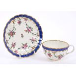 18th century Worcester polychrome fluted tea cup and saucer with painted floral swags and blue and