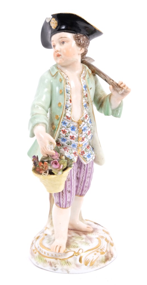 19th century Meissen porcelain figure of a gardener with hoe and basket of flowers,