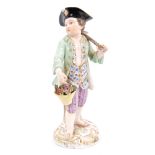 19th century Meissen porcelain figure of a gardener with hoe and basket of flowers,
