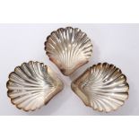 Set of three 19th century silver plated dishes of scallop shell form, with engraved armorials,