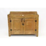 19th century American rustic pine washstand with galleried top and enclosed by pair of panelled