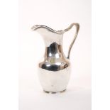 American silver milk jug of baluster form, with loop handle with male mask, mark to base - Sterling,