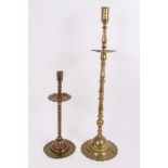 18th / 19th century brass altar candlestick with faceted and turned decoration, on bell-shaped base,