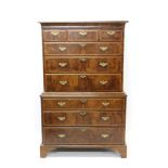 Good George II walnut crossbanded and feather-strung chest on chest with concave cornice and three