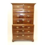 George III mahogany chest on chest with concave cornice and two short over six long graduated