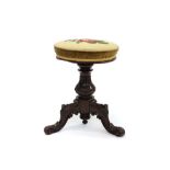 Victorian rosewood piano stool with circular floral tapestry seat rising on a thread,