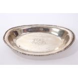 American silver bread dish of navette form, with laurel borders, engraved initials to centre,