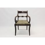 Regency mahogany elbow chair with bar back and slip-in seat on reeded sabre legs