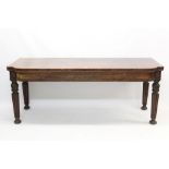 George IV mahogany breakfront serving table with moulded frieze raised on acanthus carved knopped