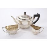 Victorian silver composite three piece tea set - comprising teapot of half-fluted form,