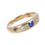 Victorian sapphire and diamond three stone ring with central mixed cut blue sapphire flanked by two