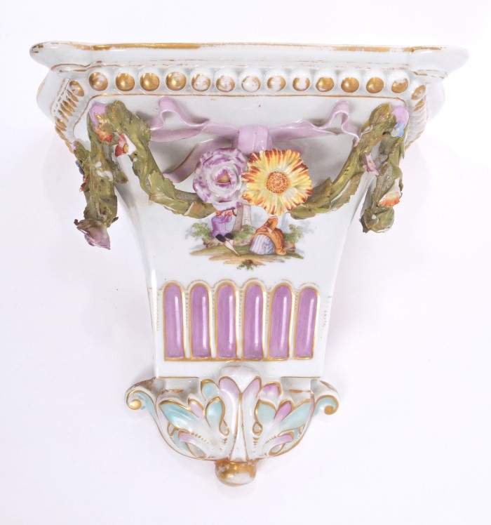Late 19th century German porcelain wall bracket with painted figures and floral swag decoration,