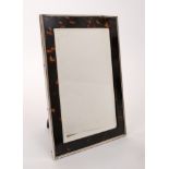 Good quality 1920s silver and tortoiseshell easel back dressing mirror of rectangular form,