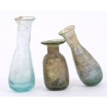 Three small Ancient iridescent glass tear bottles - believed Roman, 4cm - 6.