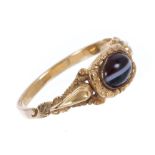 Regency gold and banded agate ring, the oval banded agate cabochon in cast and chased gold mount,