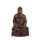 18th / 19th century Chinese gilded and red lacquered wooden figure of Buddha in traditional serene