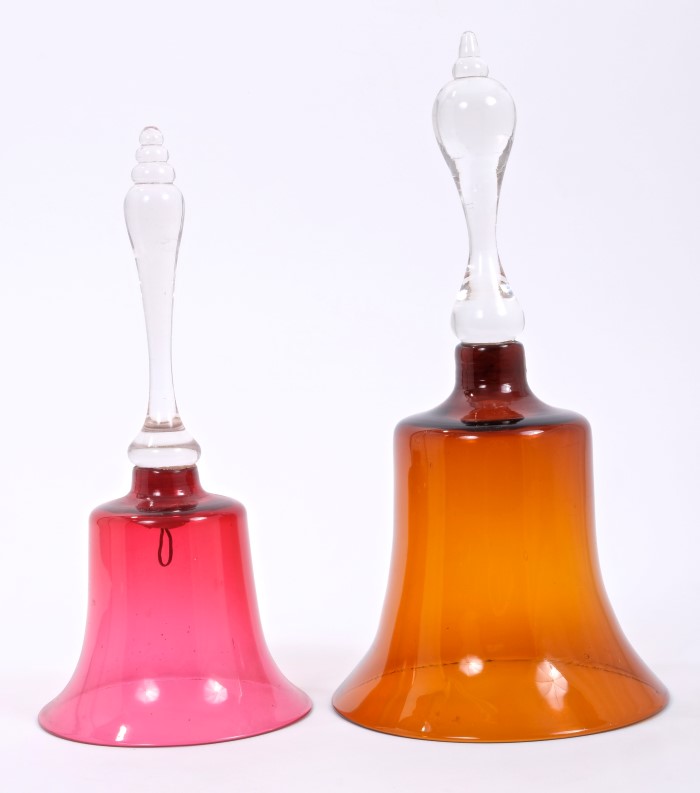 Two Victorian ruby glass bells with clear glass handles,