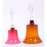 Two Victorian ruby glass bells with clear glass handles,