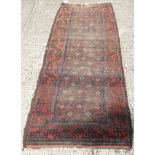 Eastern runner, brick-red ground with geometric ornament in multiple geometric borders,