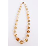 Citrine and cultured pearl necklace with a graduated string of faceted citrine beads interspaced by