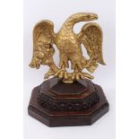 Unusual gilt metal sculpture of an eagle with outspread arms on flowering branch,