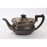 1920s silver teapot of cauldron form, with fluted decoration,