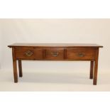 George III and later cherry-wood serving table with end slide and three drawers, on square supports,