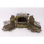 Highly elaborate antique green painted toleware bird cage of theatrical form,