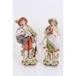 Pair late 19th / early 20th century Continental porcelain figures of huntsmen with gun and game and