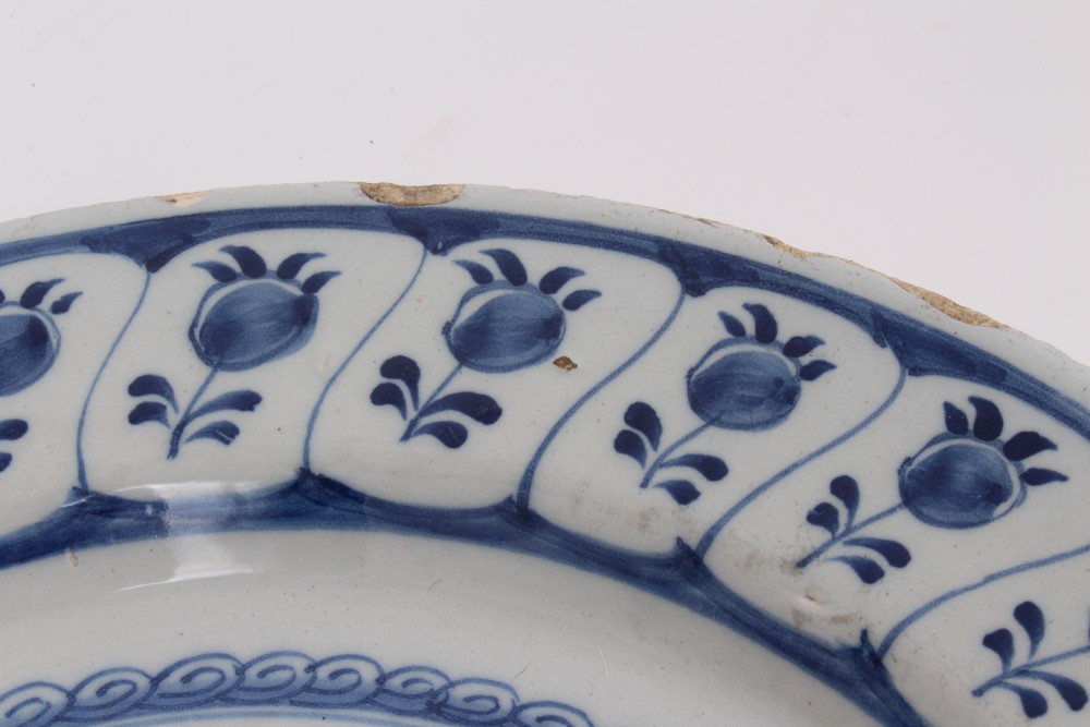 Mid-18th century Delft blue and white tin glazed charger with painted still life of flowers and - Image 4 of 6