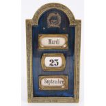 Early 20th century French gilt brass and enamelled desk calendar with revolving day,