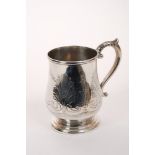 Victorian silver christening mug of baluster form, with scroll handle, on stepped circular foot,