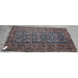 Antique Hamadan rug with navy ground and allover branch-work foliate ornament, in meander borders,