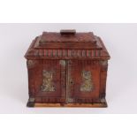 Regency red leather covered table cabinet of casket form, with gilt metal ring handles,