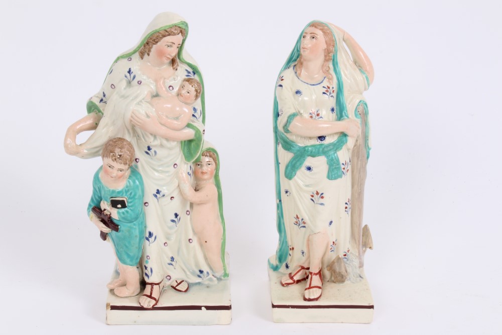 Pair early 19th century pearlware square based figures depicting Faith and Hope - one holding