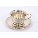 Edwardian silver teacup and saucer by William Comyns (London 1904) of usual form,
