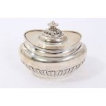 Edwardian silver tea caddy of oval form with half fluted body,