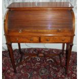 Edwardian mahogany writing table with tambour slide enclosing fitted pull-out interior and