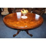 Victorian figured walnut and line-inlaid oval loo table with inlaid bands,