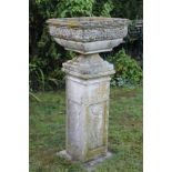 Classical revival concrete square urn on plinth with relief figural panels,