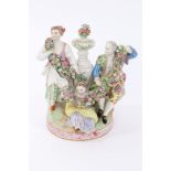 19th Century Meissen-style figural group modelled with three figures in 18th Century attire holding