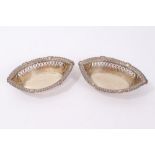 Pair of Edwardian pierced bon bon dishes (Chester 1901) of navette form, 19cm long,