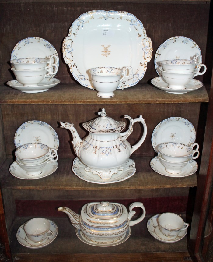 Early 19th century Derby teapot and cover on stand together with a pair of Derby tea cups and