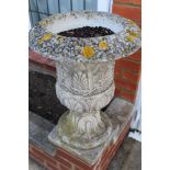 Set of six classical-style concrete garden urns, on integral plinth bases,