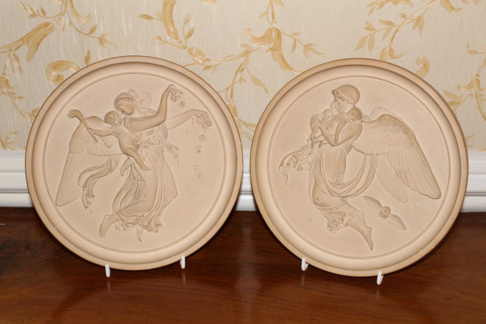 Pair of antique Danish terracotta circular plaques by P.